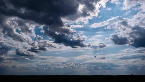 Timelapse of Sun Rays Through Clouds Over Landscape Stock Footage 309372155