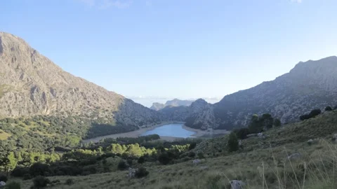 Timelapse of the sun rising in the mountains of mallorca during a sunny day Stock Footage 166393605
