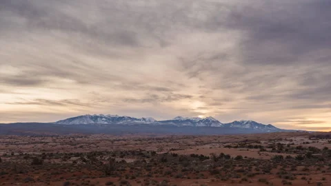 Timelapse of the Sun Rising Through  Clouds in Arches National Park Stock Footage 258148203