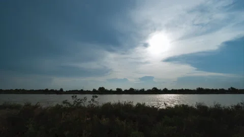 Timelapse of sun setting above nowhere pond. Stock Footage 156381445