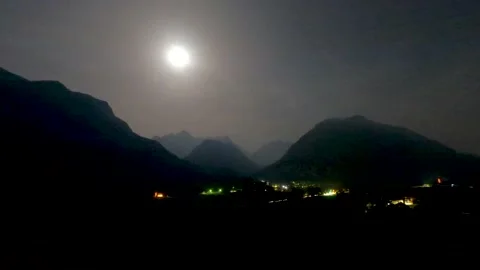 A timelapse of the sun setting and rising again over the alpes in austria Stock Footage 157207738