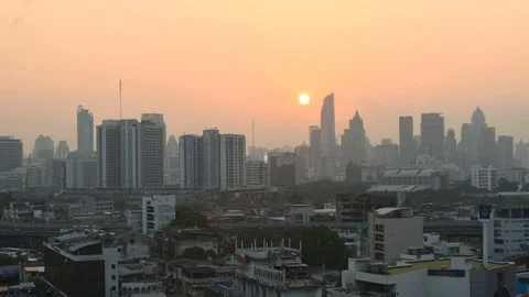 Timelapse of The sun is setting behind the building in Bangkok. Stock Footage 80411151