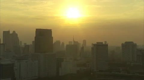 Timelapse of sun setting behind clouds skyline of Bangkok Stock Footage 13583270