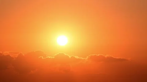 Timelapse of sun setting behind clouds in sky Stock Footage 343601032