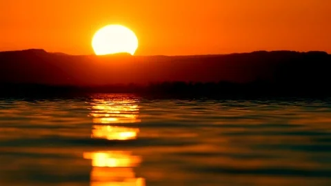 Timelapse of the sun setting behind a mountain Stock Footage 86409742