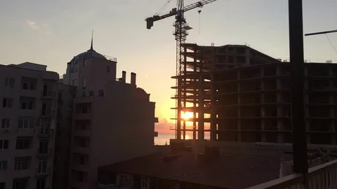 Timelapse Sun setting Behinde Building Stock Footage 76021133