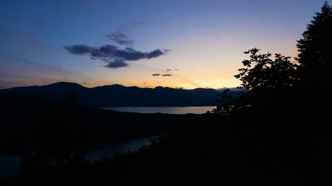 Timelapse of the sun setting over Harrison Lake Stock Footage 113441095
