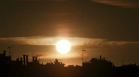 Timelapse of sun setting over Paris rooftops Stock Footage 10682635