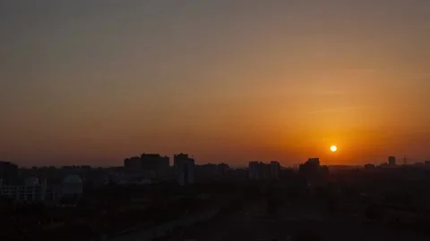 Timelapse of Sun setting with wide view over cityscape in Pune Video stock 136223047
