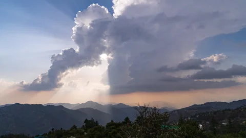 Timelapse - Sun shining through the clouds during a clear day 4K30 Stock Footage 268060132