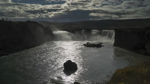 Timelapse of the sun through the clouds and falling water at Godafoss Stock Footage 170006303