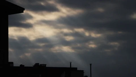Timelapse - Sunbeams shining through the clouds Stock Footage 119384557