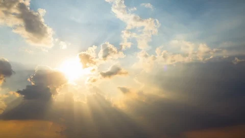 Timelapse, sunburst or sun rays light beam through the clouds as fantastic Stock Footage 121726767