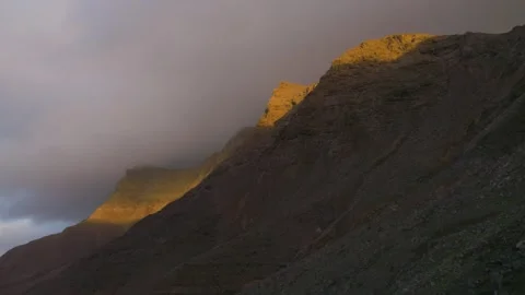 Timelapse of sunlight moving over mountain landscape dramatic light 스톡 동영상 331194705