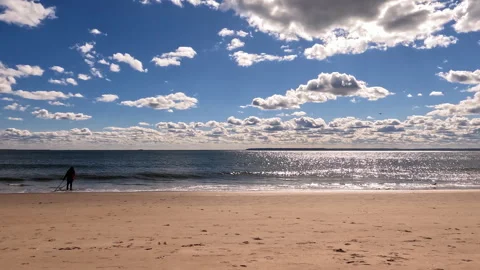 Timelapse of a sunny beach with sparkling ocean waves, Calm sandy beach with Stock Footage 301558403
