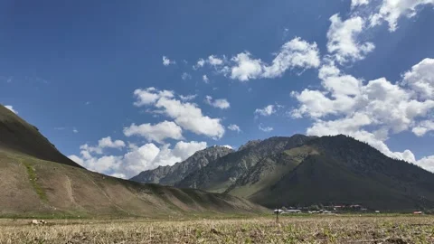 Timelapse Sunny Day in the Mountains - Clouds Moving Across the Sky Above  Stock Footage 287200729
