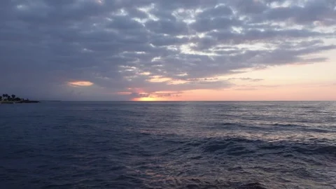 Timelapse of sunrise between clouds at sea Stock Footage 283276254