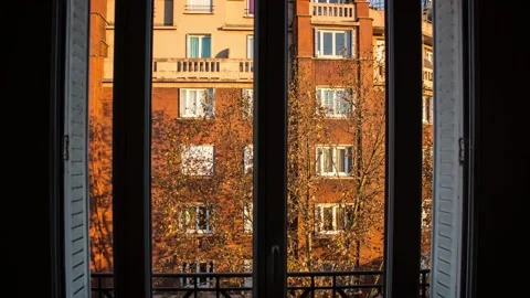 Timelapse - Sunrise on a building from a window Stock Footage 165683095