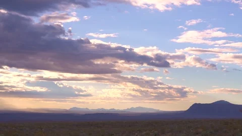 Timelapse Sunrise Clouds Moving Across Sky at Chisos Mountains Stock Footage 258474143