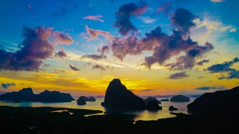 Timelapse sunrise with dramatic sky cloud mountain sea bay Stock Footage 112635514