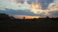 Timelapse of sunrise over countryside, clouds running across sky HD Footage