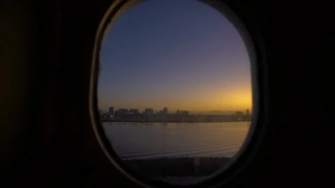Timelapse of Sunrise over Long Beach California through ship porthole window Video stock 116984816