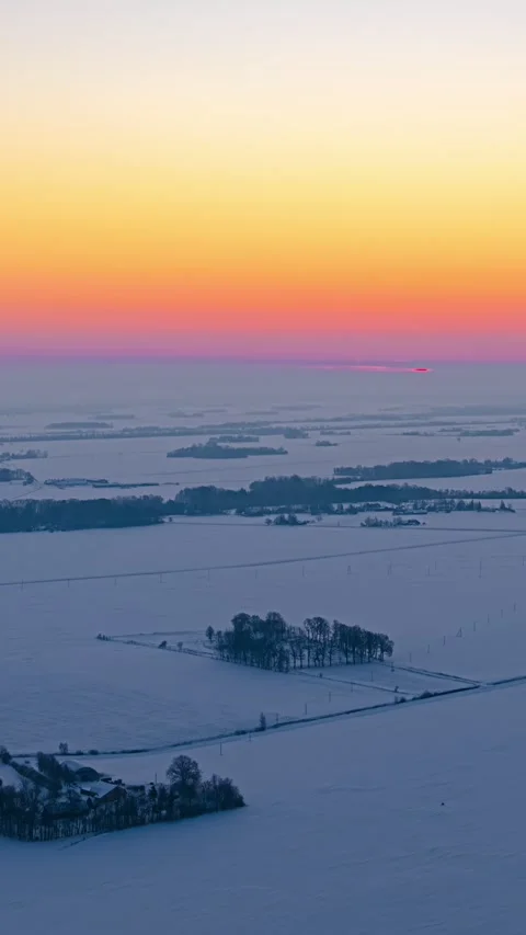 Timelapse of Sunrise Over Snow-Covered Rural Fields and Trees in Winter Stock Footage 337648200