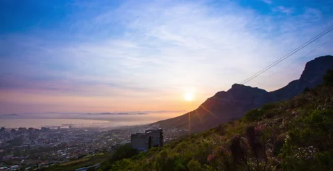 Timelapse: Sunrise overlooking Table Mountain aerial cableway Stock Footage 236554160
