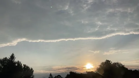 Timelapse sunrise with some rays of light through clouds Stock Footage 286167325