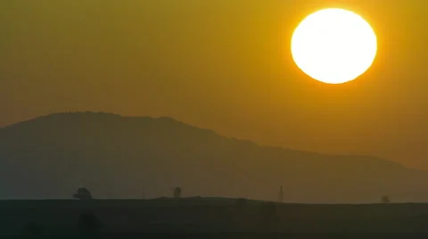 Timelapse, sunrise,sun rises behind mountain in countryside Video stock 49970222