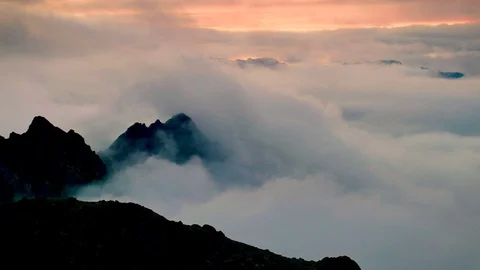 Timelapse of sunset above the clouds with silhouettes of mountain tops Stock-Footage 71199213