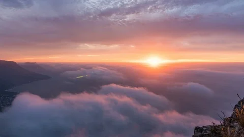 Timelapse of sunset above colorful clouds from Lions Head Cape Town South Africa Stock Footage 107486777