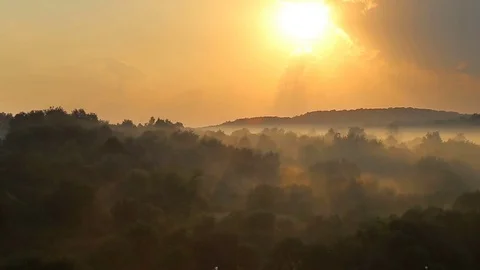 Timelapse sunset above steaming forest after rain Stock Footage 78970471