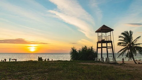 Timelapse sunset above watch tower in Karon beach Stock Footage 122548144