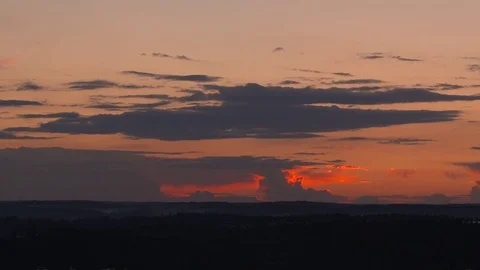 Timelapse of a sunset and clouds over a forest Video stock 84268163