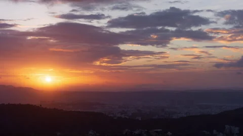 Timelapse - Sunset and clouds rolling over the city 4K60 Stock Footage 270431590