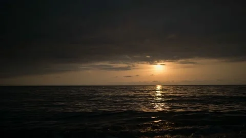 Timelapse sunset background. Cloudy cloudy weather at sea. Focus on the sea Stock Footage 197418512