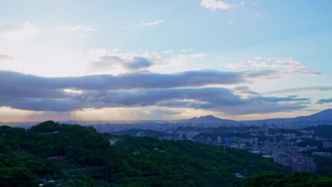 Timelapse of a sunset with beautiful sunrays shining through the clouds Stock Footage 246428865