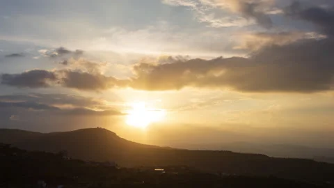 Timelapse - Sunset behind clouds 4K Stock Footage