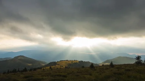 Timelapse of Sunset behind Clouds in Nature Stock Footage 119322306