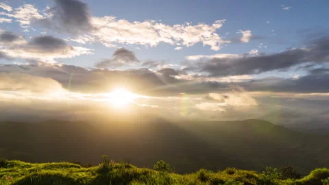 Timelapse - Sunset behind a mountain and clouds with colour explosion 4K60 Stock Footage 270082828