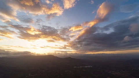 Timelapse - Sunset behind a mountain with clouds and colour explosion 4K60 Stock Footage 270141649
