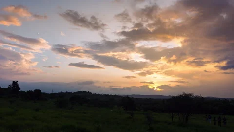 Timelapse - Sunset behind mountains and clouds with colour explosion 4K30 Stock Footage 271199007