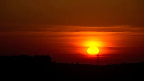 Timelapse of sunset behind a powerline Stock Footage 78020251