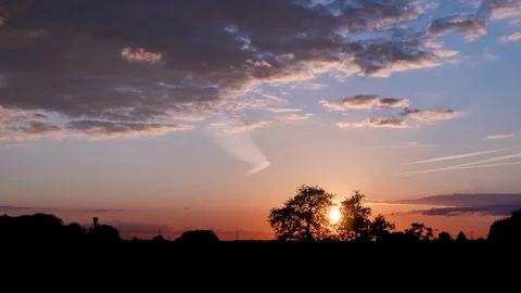 Timelapse of Sunset in Belgium with beautiful plane trail Stock Footage
