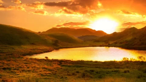 Timelapse sunset between mountains in landscape with lake, sky hot Stock Footage 133473835