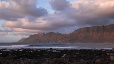 Timelapse sunset in Cale de Famara in Lanzarote  h264-420 4KUHD 29.97 VHQ Stock Footage 107453230