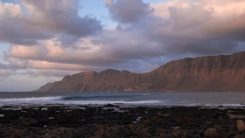 Timelapse sunset in Cale de Famara in Lanzarote H265-444 4KUHD 29.97 VHQ Stock Footage 107453237