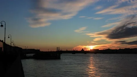 Timelapse of the sunset in the city from the waterfront Stock Footage 130176553