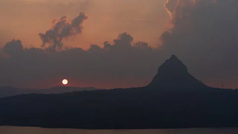 Timelapse - Sunset close shot behind a mountain 4K60 Stock Footage 268789247